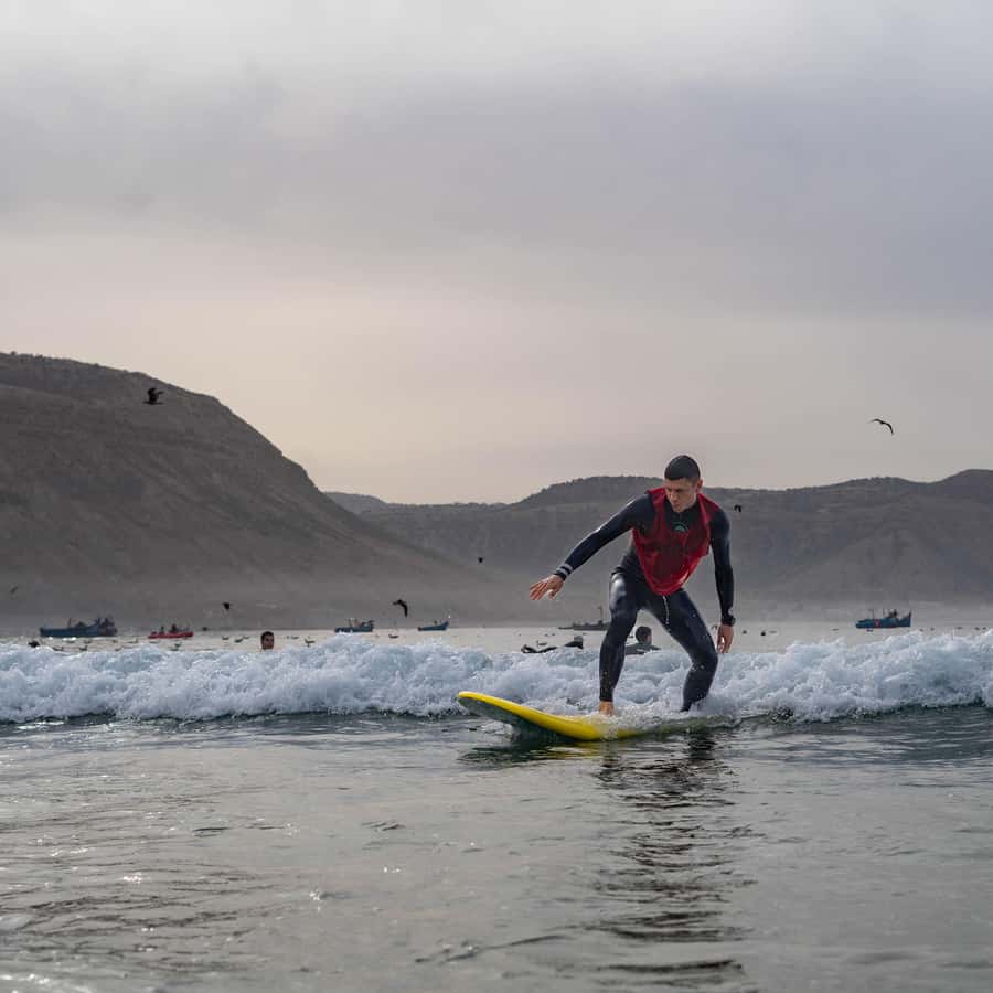 Agadir: Beginner Surf Lesson & Experience in Morocco - Warm-up, equipment, and the first board lesson