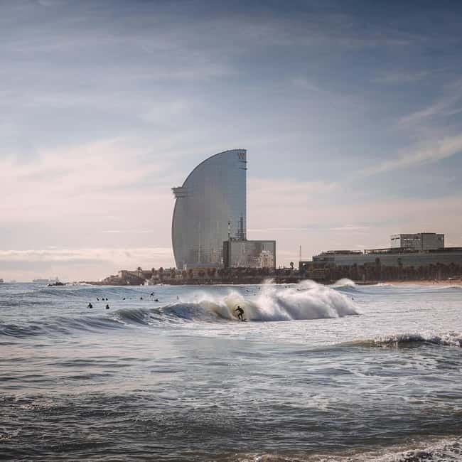 Barcelona: Sunrise or Sunset Paddle Surf with Photos - Paddling along Barcelona’s coastline