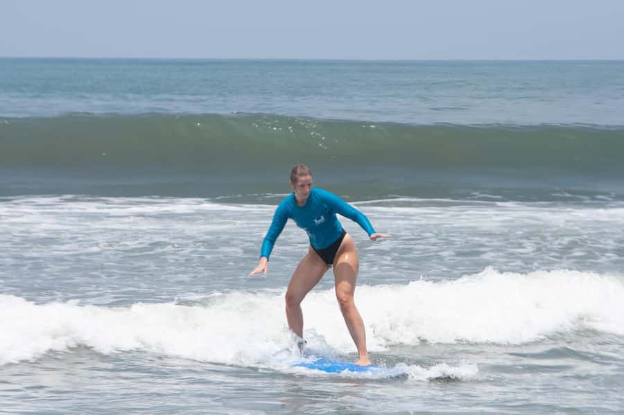 Beginner Surf Lessons in Canggu - Into the water: catching your first waves