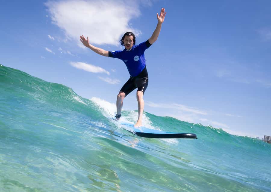 From Byron Bay: Learn to Surf Half-Day Tour - Finding a beginner-friendly beach