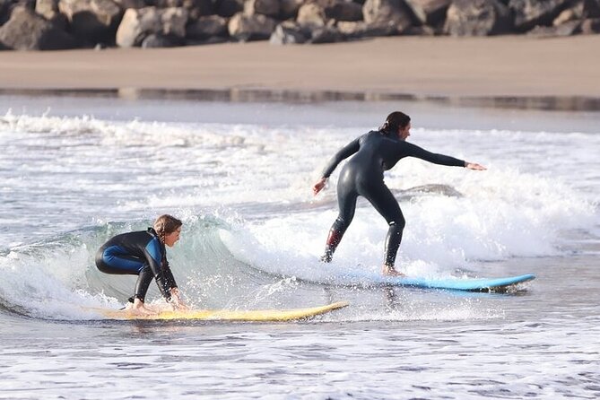 Group Surf Class in Playa de Las Américas with Photographs - Warm-up, then into the water