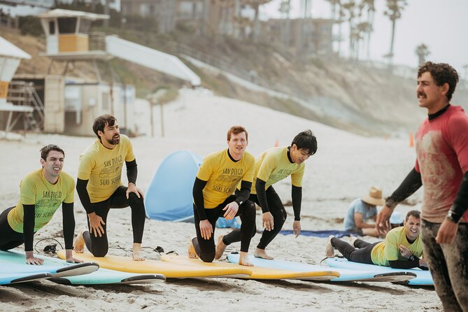 Group surf lesson - The first 20 minutes: warming up and learning on the sand