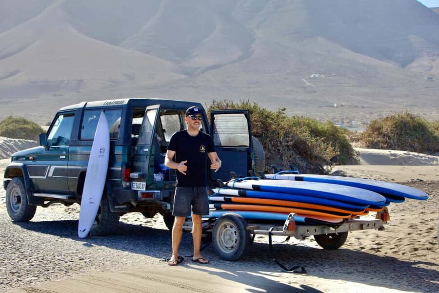 Group surf lessons in Lanzarote, learn with a local team - Starting with warm-up and sea safety