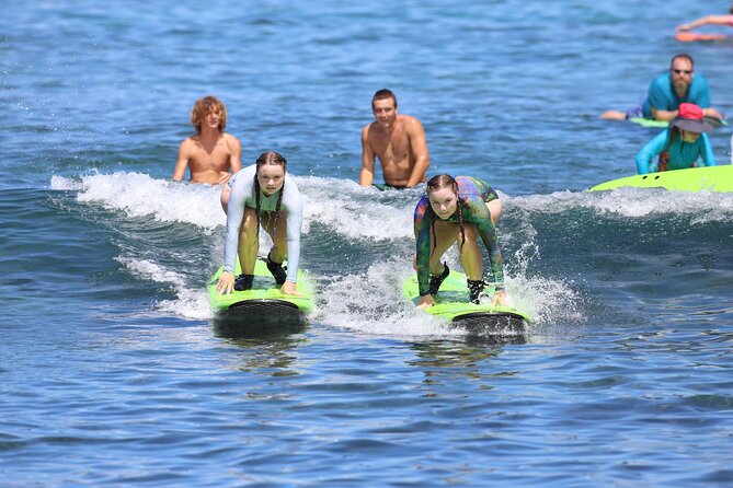 Kona Surf Lesson in Kahaluu - Learning the pop-up before entering the water