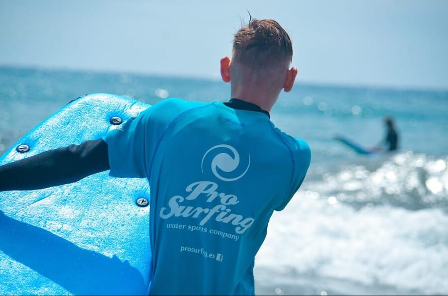 Las Palmas: Learn to Surf with a Special Price for Two Group - Getting into the water with equipment included