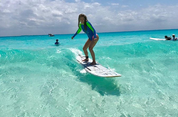 Learn to Surf in 1 Easy Lesson in Cancún - Getting into the water with an instructor