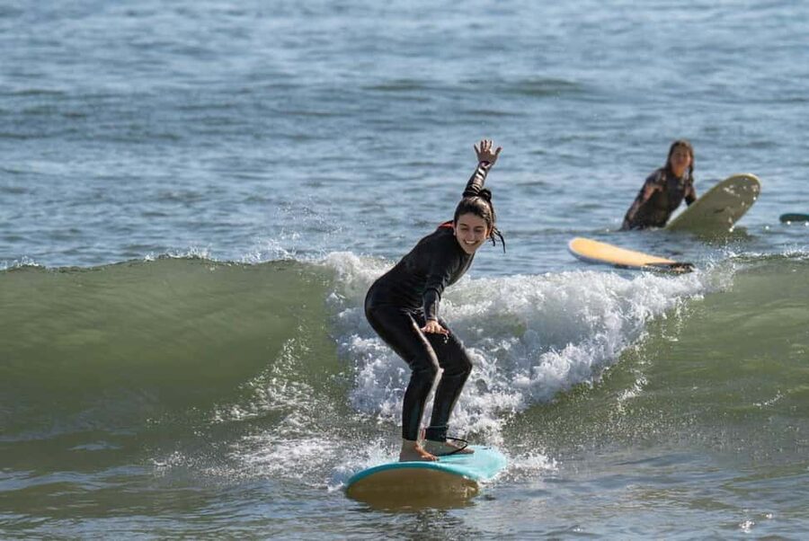 Lisbon Surf Guide - Surf class & Pick Up - Getting fitted for a wetsuit