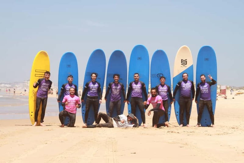 Lisbon: The Surf Instructor - surf lessons with transfer - Getting suited up with board and wetsuit