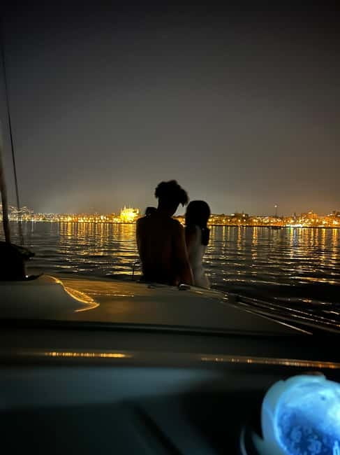 Majorca: Dinner aboard a private catamaran with snorkeling and paddle surfing - Returning to Palma after sunset