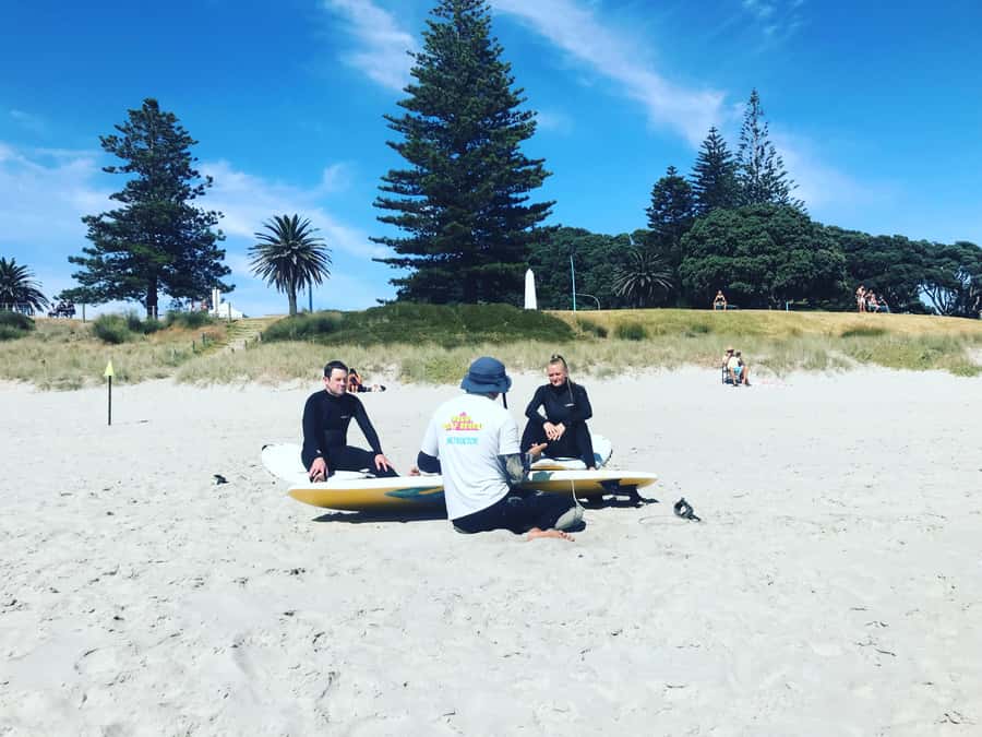 Mount Maunganui: Group Beginner Surf Lesson - Meeting the coaches at the Mount Surf School tent