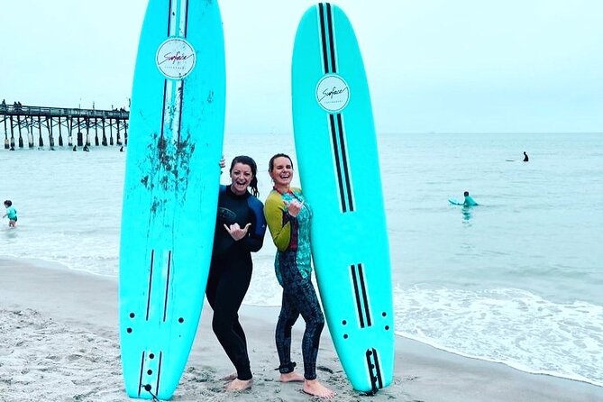 One Hour Surf Lesson with Experienced Instructor - Entering the Atlantic with an instructor nearby