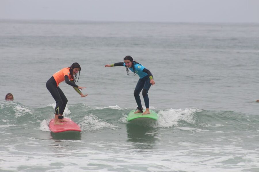Porto: Small Group Surf Lesson with Transportation - Patient coaching from the sand to the water