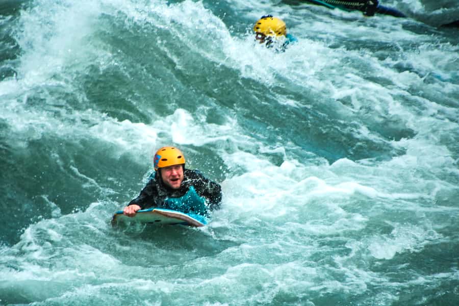 Queenstown: White Water Surfing Along the Kawarau River - The cliff-jump stop and calmer river scenery
