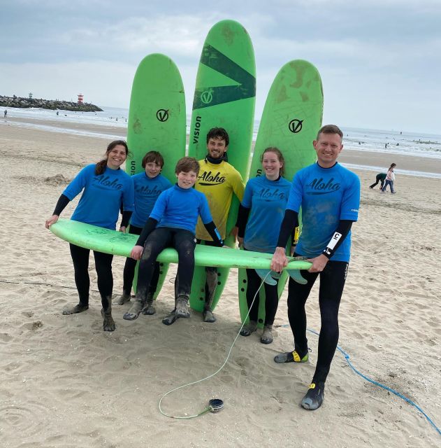 Scheveningen Beach: 1,5 hour Surf experience for families - Getting into the Dutch waves
