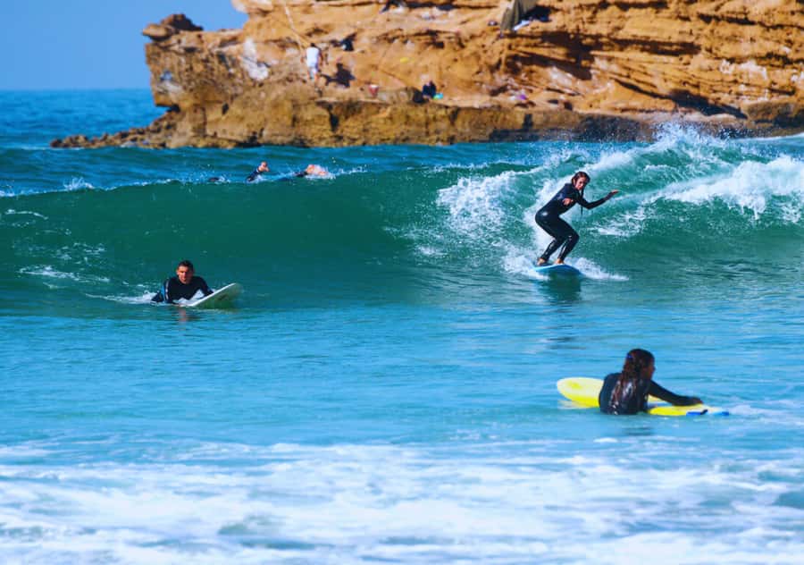 Surf Training and Lunch on Essaouira Day Trip from Marrakech - Getting into the water at Essaouira