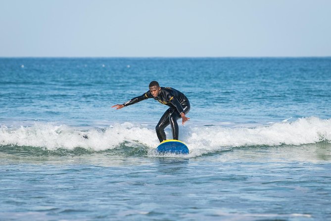Surf, Yoga & Glamping Weekend in Cornwall - Surfing near Fistral Beach with patient instruction