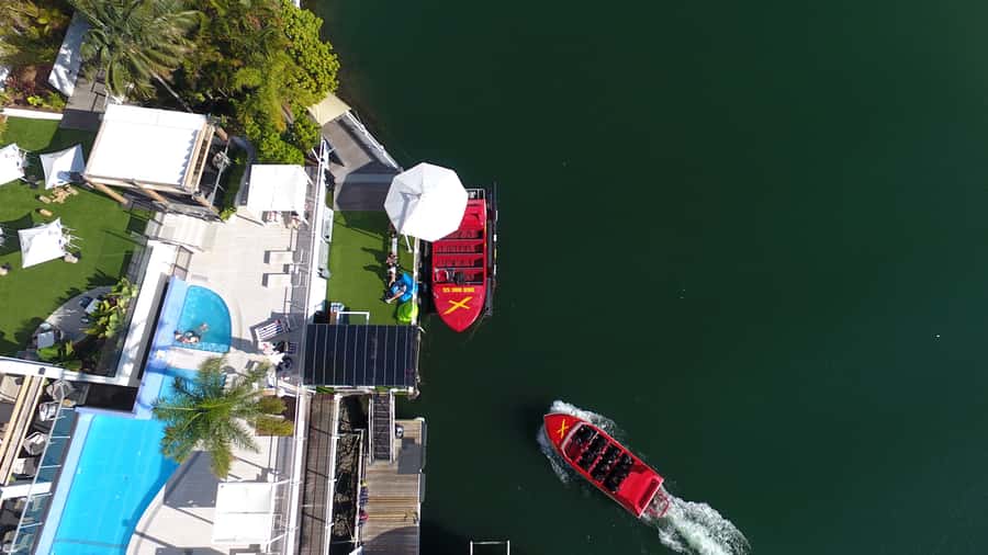 Surfer's Paradise: Jetboat Ride and Surf Lesson - Flexible booking for changing beach plans