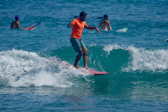 Surfing lesson at beautiful beach Playa Encuentro - Orlando and Daniel bring patience to beginners