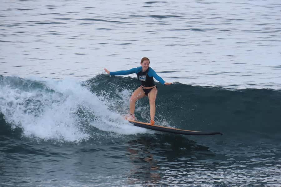 A surfer on a green Indian Ocean wall at Uluwatu